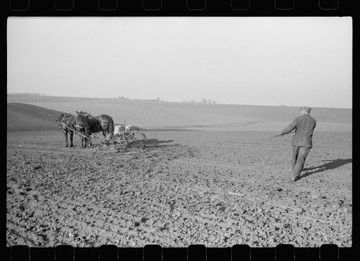Untitled photo, possibly related to: Oiling planter preparatory to corn planting, Jasper County, Iowa