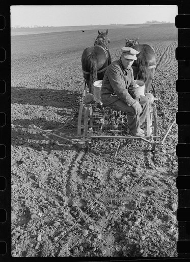 Untitled photo, possibly related to: Oiling planter preparatory to corn planting, Jasper County, Iowa