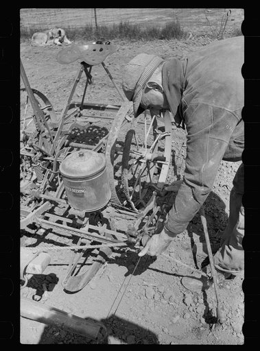 Untitled photo, possibly related to: Calibrating the corn planter, Jasper County, Iowa
