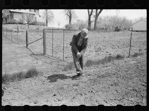 Untitled photo, possibly related to: Calibrating the corn planter, Jasper County, Iowa