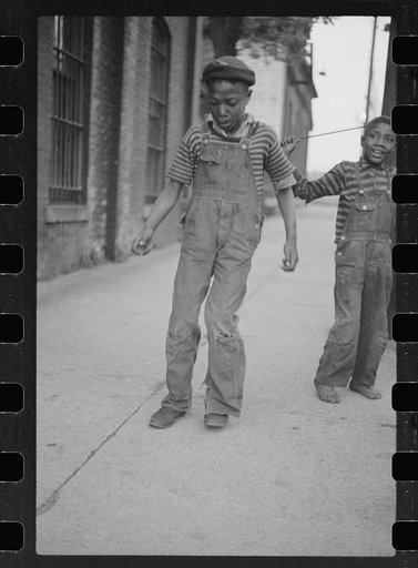 Boy dancing for arrivals at hotel, price five cents, Cairo, Illinois