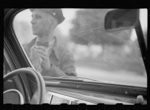 Untitled photo, possibly related to: Wiping off windshield in service station, Cairo, Illinois