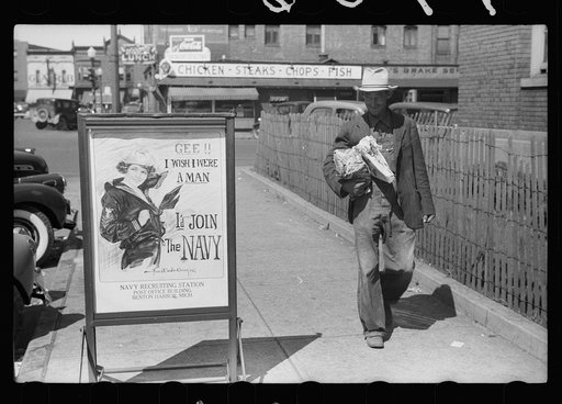 Migrant fruit worker from Arkansas walking by the post office, Benton Harbor, Michigan