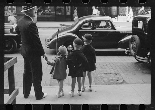 Untitled photo, possibly related to: Father and three children waiting to cross the street, Chicago, Illinois