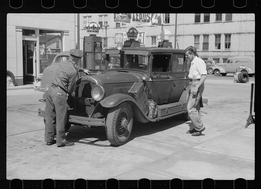 Auto of migrant fruit worker at gas station, Sturgeon Bay, Wisconsin