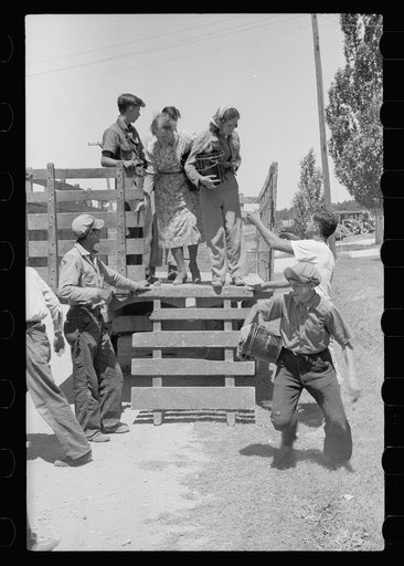 Cherry pickers getting off truck which brought them back to camp, Door County, Wisconsin