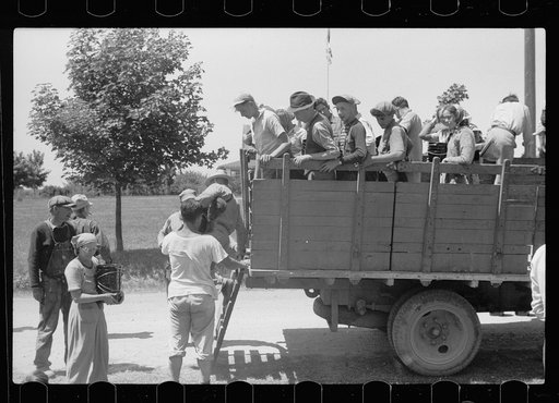 Cherry pickers getting off truck which brought them back to camp, Sturgeon Bay, Wisconsin