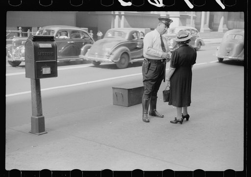 Untitled photo, possibly related to: Lady talking to policeman, Chicago, Illinois