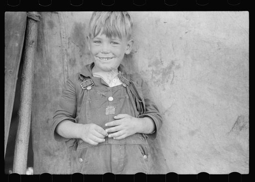 Untitled photo, possibly related to: Migrant child eating in front of tent home, Berrien County, Michigan