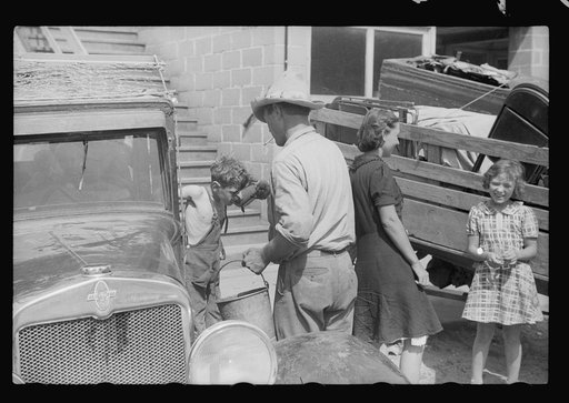 Migrant family getting ready to move on in search for work, Berrien County, Michigan