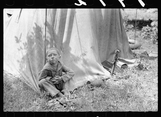 Migrant child in front of tent home, Berrien County, Mich.