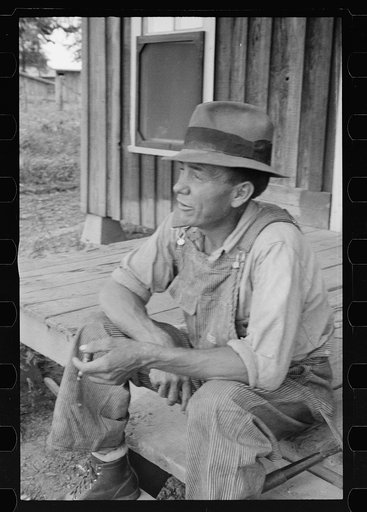 Untitled photo, possibly related to: Sharecropper and children in front of company house. Wilson cotton plantation, Mississippi County, Arkansas
