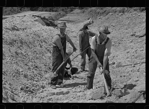 Farmers who have been resettled at Skyline Farms, at work in sand pit