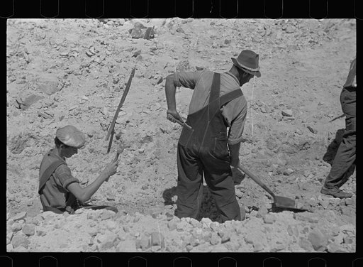Untitled photo, possibly related to: Farmers who have been resettled at Skyline Farms, at work in sand pit