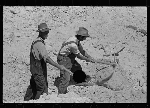 Untitled photo, possibly related to: Farmers who have been resettled at Skyline Farms, at work in sand pit