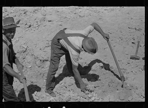 Untitled photo, possibly related to: Farmers who have been resettled at Skyline Farms, at work in sand pit