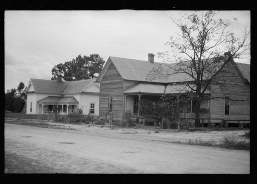 Old house with remodeled house in background, Irwin County, Georgia