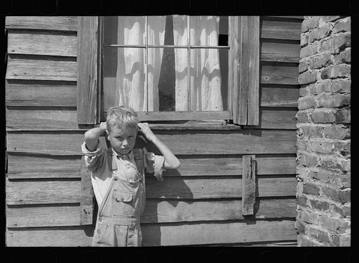 Untitled photo, possibly related to: Son of a farmer on Wolf Creek Farms project who has not yet been moved to a new house, Wolf Creek Farms, Grady County, Georgia