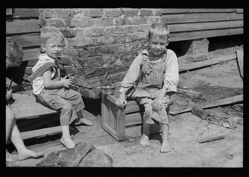 Untitled photo, possibly related to: Son of a farmer on Wolf Creek Farms project who has not yet been moved to a new house, Wolf Creek Farms, Grady County, Georgia