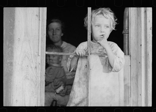 Daughter of sharecropper, Wilmington, North Carolina. Mother and another child in background