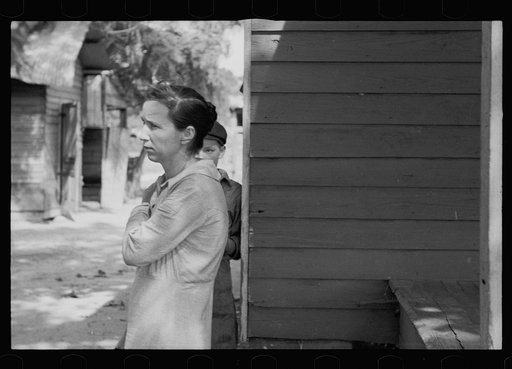 Untitled photo, possibly related to: Daughter of sharecropper, Wilmington, North Carolina. Mother and another child in background