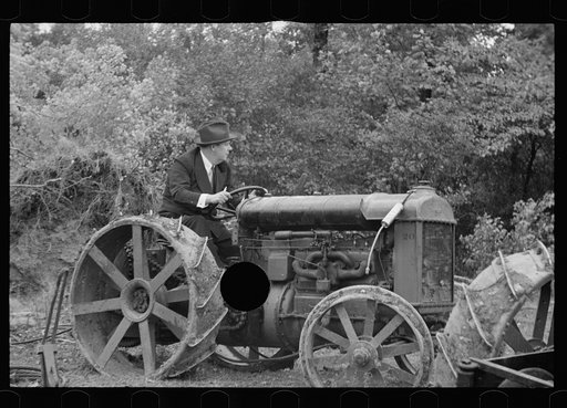 Untitled photo, possibly related to: Commissioner Allen operating tractor, Berwyn, Maryland