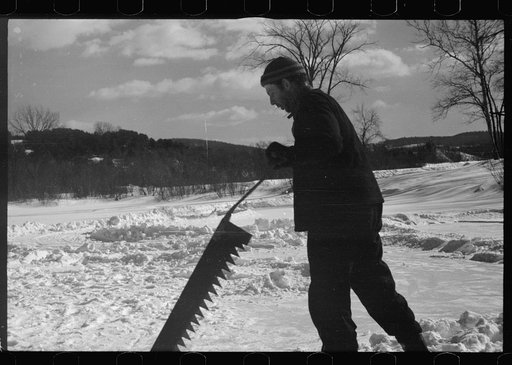 Untitled photo, possibly related to: Coos County, New Hampshire. Cutting ice on the Ottaquetchee River