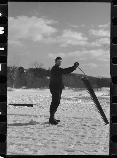Untitled photo, possibly related to: Coos County, New Hampshire. Cutting ice on the Ottaquetchee River