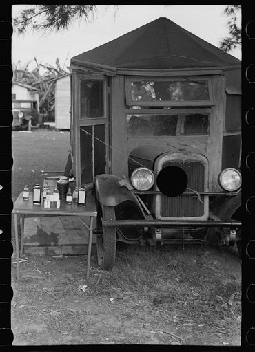 Untitled photo, possibly related to: One-legged medicine man encamped with the migrant fruit and vegetable workers at Belle Glade, Florida