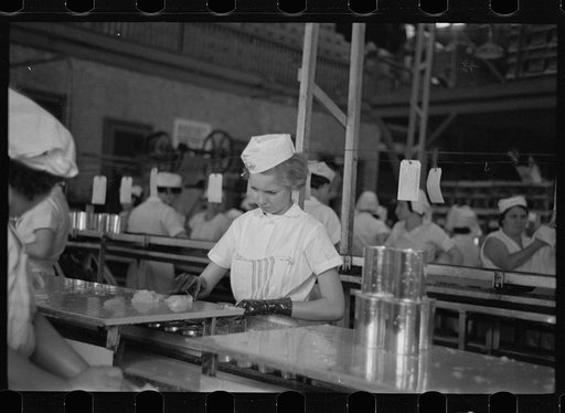 Sectioners at work canning grapefruit. About half of these girls are migrants. Winter Haven, Florida
