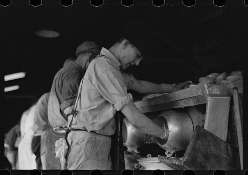 Juicers in the grapefruit canning plant at Winter Haven, Florida. Many of these men are migrants