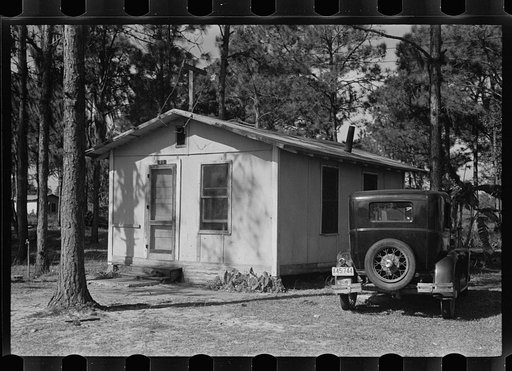 Auto and temporary home of a migratory fruit worker near Winter Haven, Florida