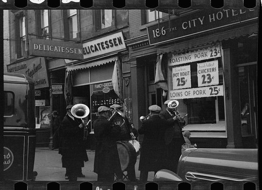 Street band on sidewalk, Eighth Avenue between West 19th and 20th Streets, New York, New York