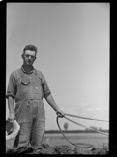 Untitled photo, possibly related to: Farmer and child, Scioto Farms, Ohio