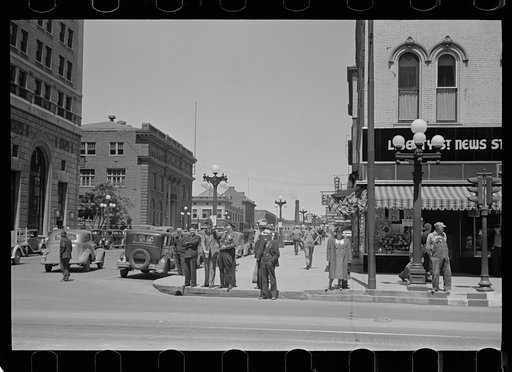 Untitled photo, possibly related to: Sign across main street, Peoria, Illinois
