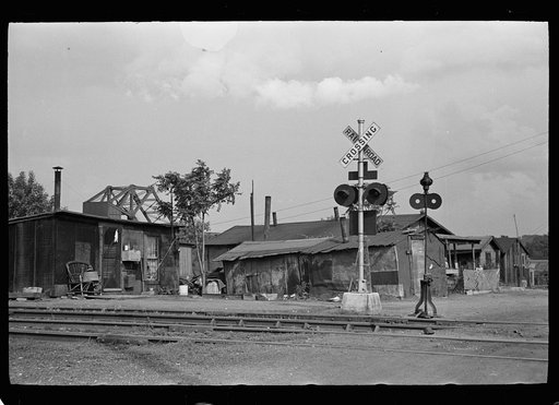 Slums at Cinder Point between railroad and Illinois River, Peoria, Illinois