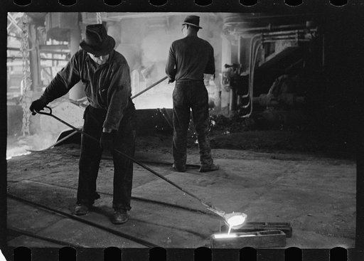 Pouring a test mold while blast furnace is being tapped, Pittsburgh, Pennsylvania