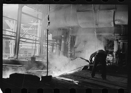 Untitled photo, possibly related to: Pouring a test mold while blast furnace is being tapped, Pittsburgh, Pennsylvania