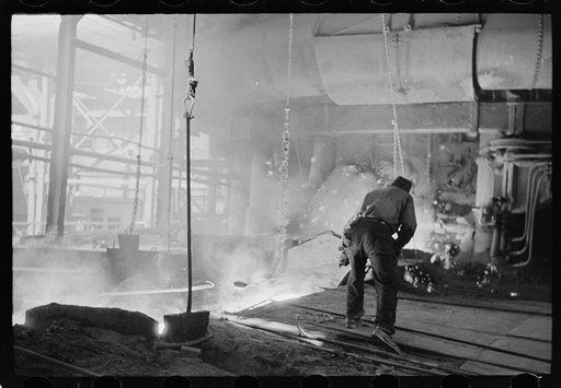 Pouring a test mold while blast furnace is being tapped, Pittsburgh, Pennsylvania