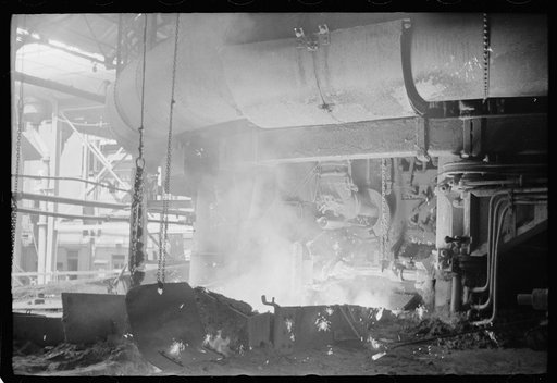 Untitled photo, possibly related to: Pouring a test mold while blast furnace is being tapped, Pittsburgh, Pennsylvania