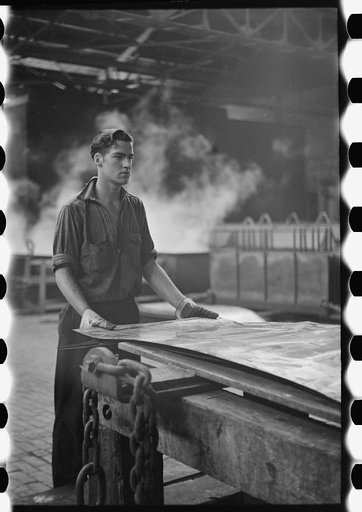 Steelworker at galvanizing machine, Pittsburgh, Pennsylvania