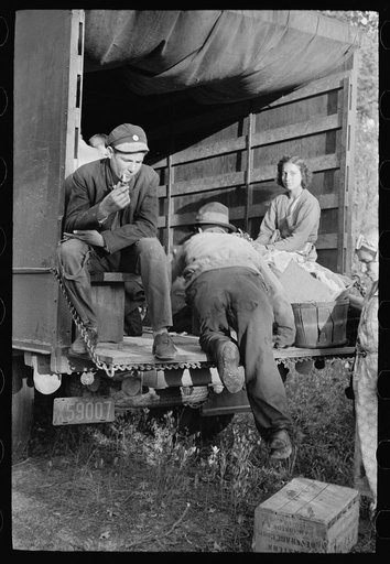 Untitled photo, possibly related to: Cranberry pickers getting into truck that will carry them back to Philadelphia, Burlington County, New Jersey