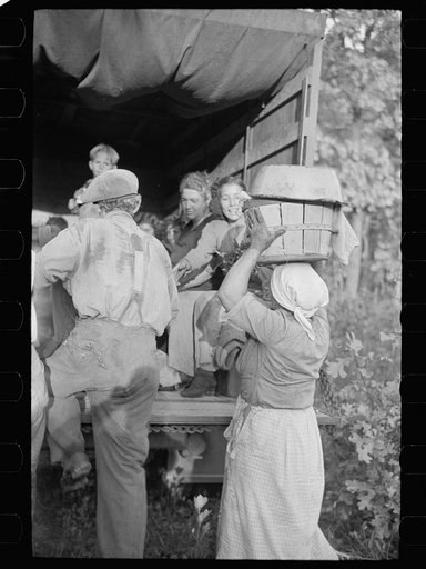 Cranberry pickers getting into truck that will carry them back to Philadelphia, Burlington County, New Jersey