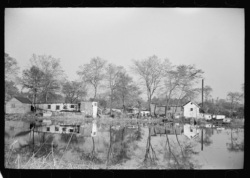 Untitled photo, possibly related to: Lack of proper housing forces mill workers into shacks along river, Millville, New Jersey