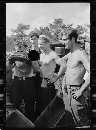 Untitled photo, possibly related to: Cranberry scoopers drinking from the top of a mild car, Burlington County, New Jersey