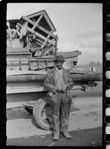 State highway officials moving sharecroppers from roadside to area between levee and Mississippi River, New Madrid County, Missouri