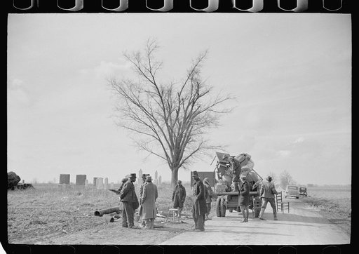 State highway officials moving sharecroppers away from roadside to area between the levee and the Mississippi River, New Madrid County, Missouri