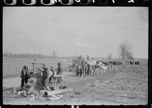 State highway officials moving sharecroppers away from roadside to area between the levee and the Mississippi River, New Madrid County, Missouri