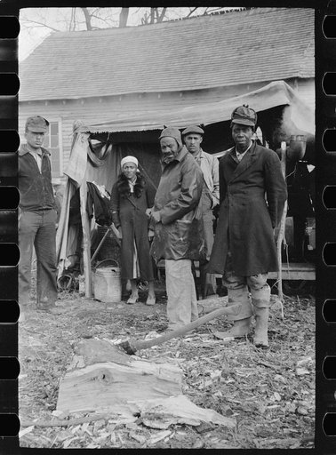 Sharecroppers being moved away from roadside by highway officials to area between levee and Mississippi River, New Madrid County, Missouri