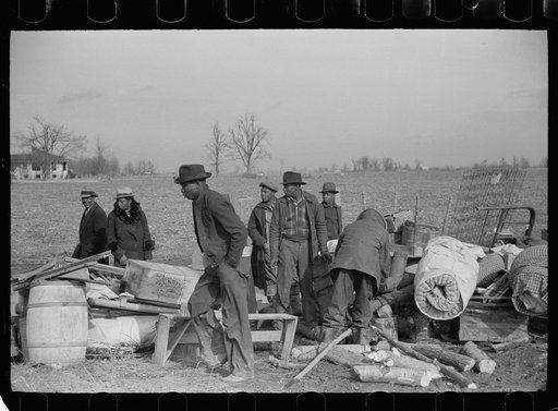 Sharecroppers being moved from roadside to area between the levee and the Mississippi River, New Madrid County, Missouri